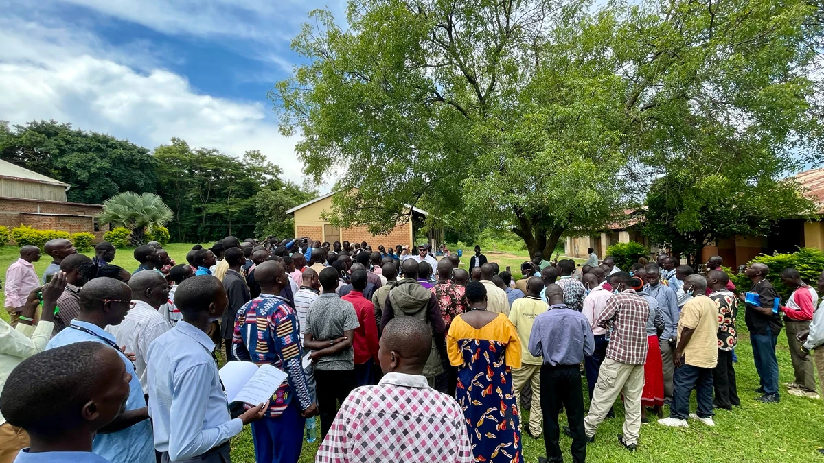 People gathered around to listen to the agricultural training