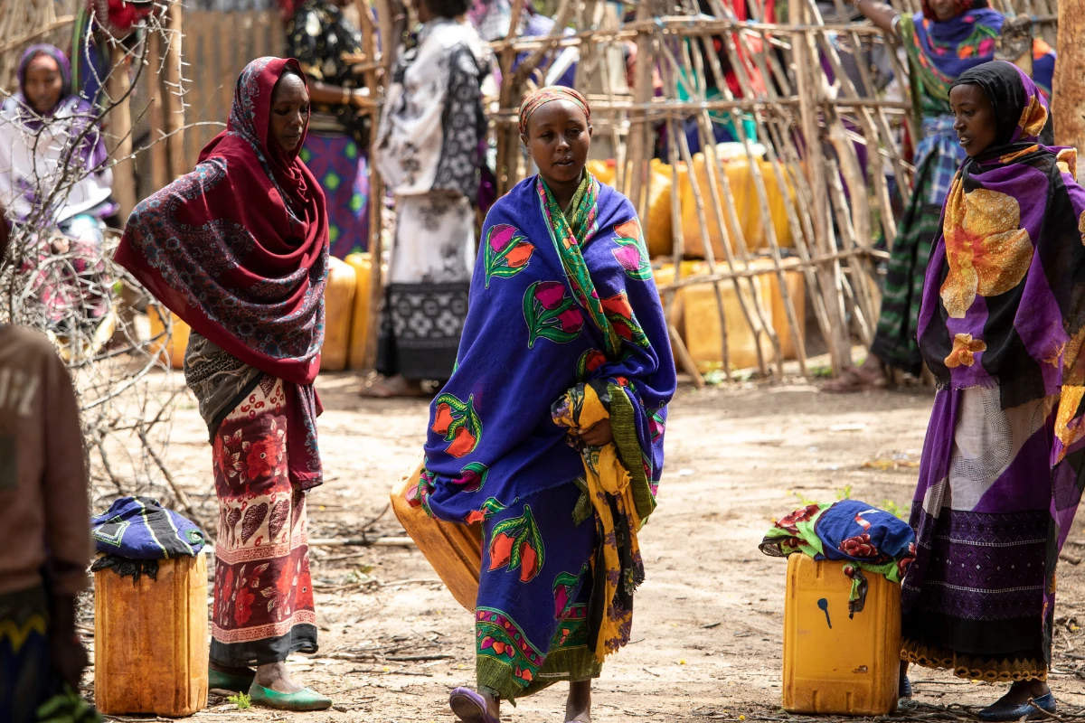 Ethiopian girl walking towards the camera at the water well Petros Network had recently drilled for an underserved, rural community in Southern Ethiopia.