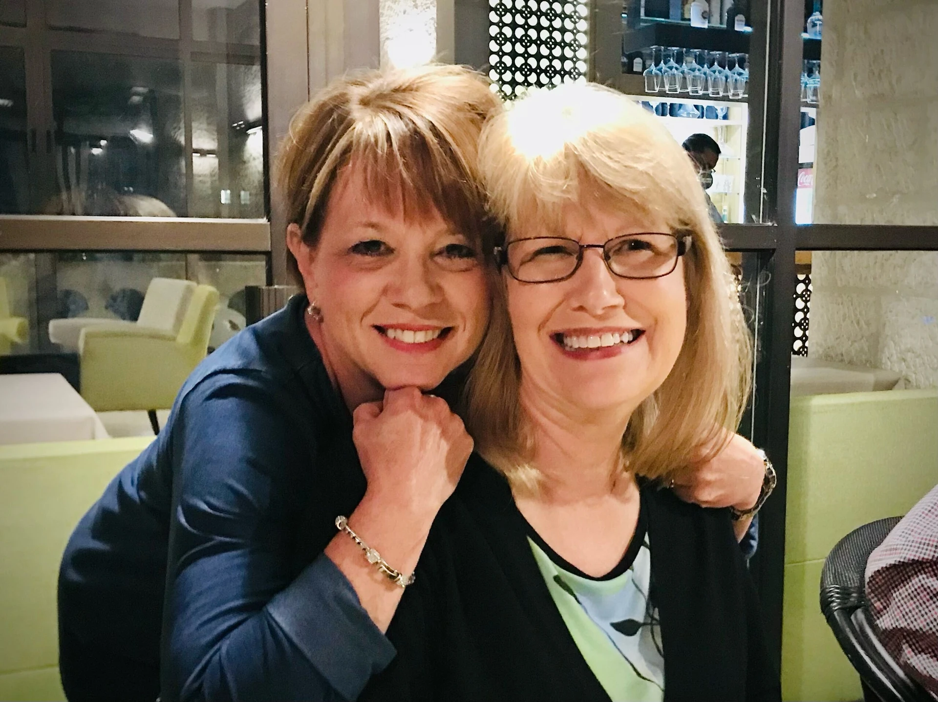 Linda and Sandy smiling to the camera